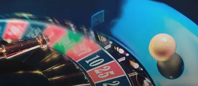 Roulette wheel and ball on a live casino table